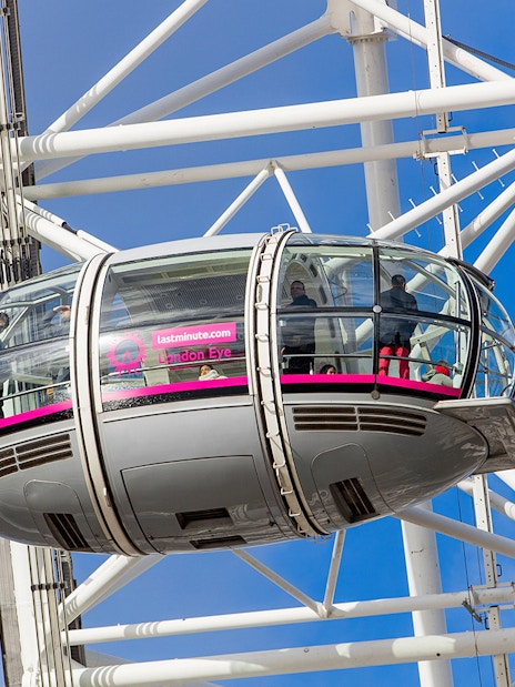London Eye pod exterior with panoramic city view in the background.