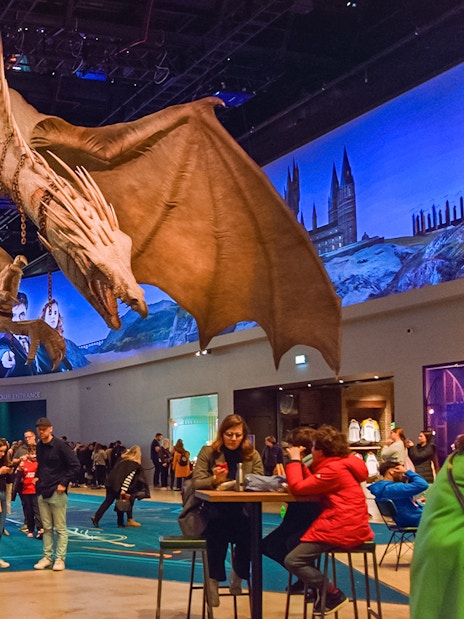 Dragon sculpture in cafeteria area of Harry Potter London tour.