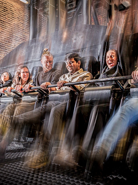 Visitors experiencing the Drop Dead Ride at London Dungeon, featuring a thrilling free-fall drop.