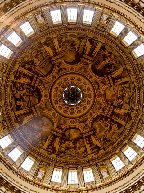 St. Paul's Cathedral inner dome with intricate frescoes and architectural details, London.