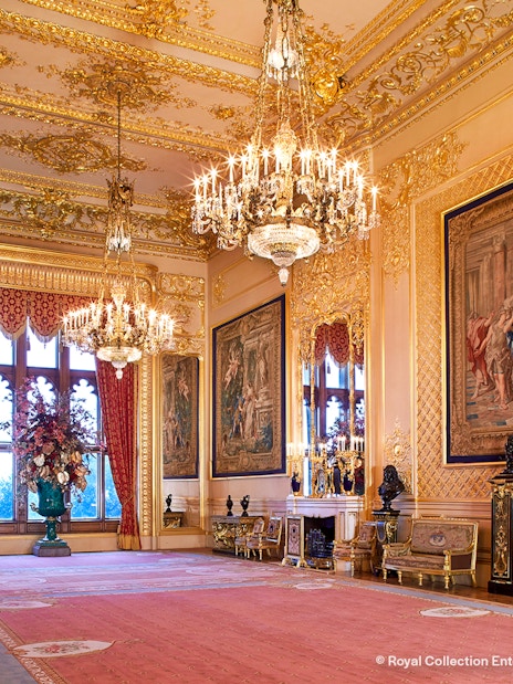 Windsor Castle interior with ornate ceiling and historical artifacts.