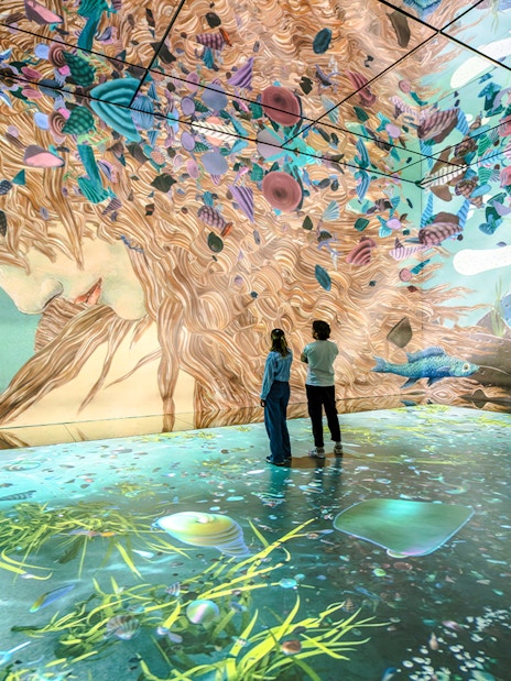 Immersive art installation with vibrant colors at Frameless London, showcasing digital art projections.