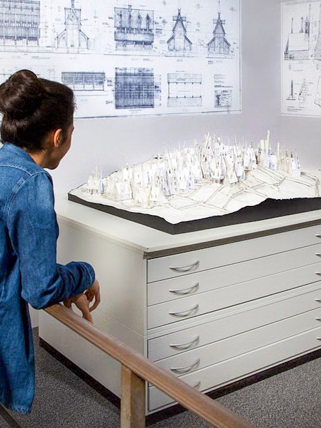 Two ladies looking at a model of Hogsmeade at Harry Potter Warner Bros. Studio, London