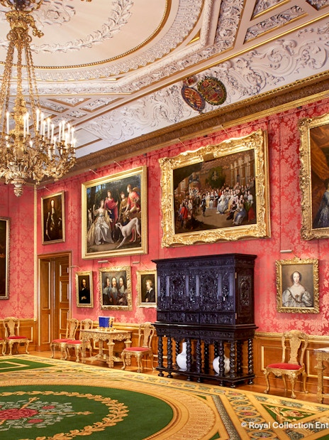 Windsor Castle interior with ornate ceiling and historical artifacts.