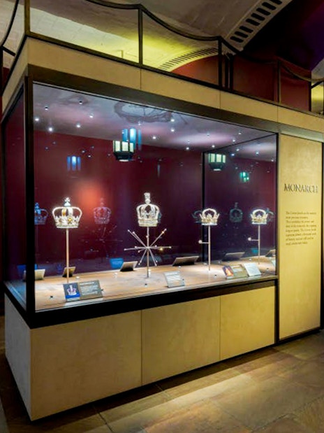 Tower of London crown jewels display with historic royal crowns and regalia.