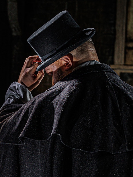 Jack the Ripper exhibit at London Dungeon with historical artifacts and dimly lit atmosphere.