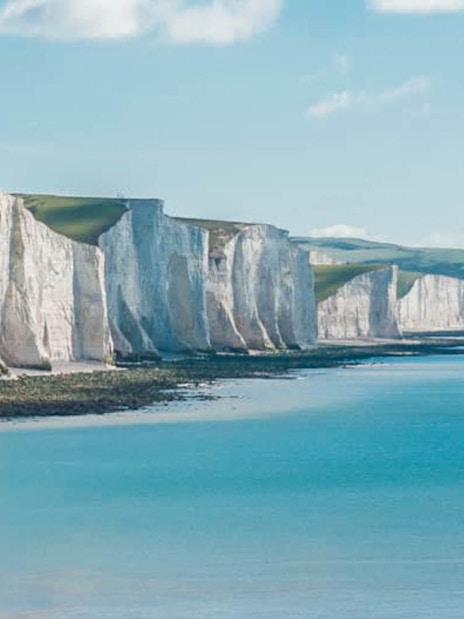 Leeds Castle with moat, Canterbury Cathedral, and White Cliffs of Dover in England tour.