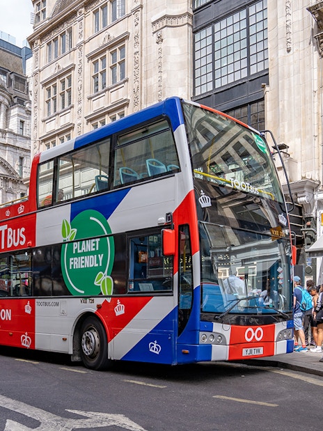 Tourists on Tootbus passing Big Ben during London Hop-On Hop-Off Bus Tour.