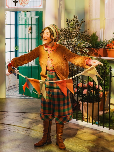 Children exploring interactive Paddington Bear exhibits at London tour.