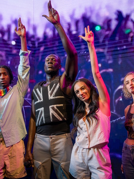 Stormzy wax figure at Madame Tussauds London with interactive display.
