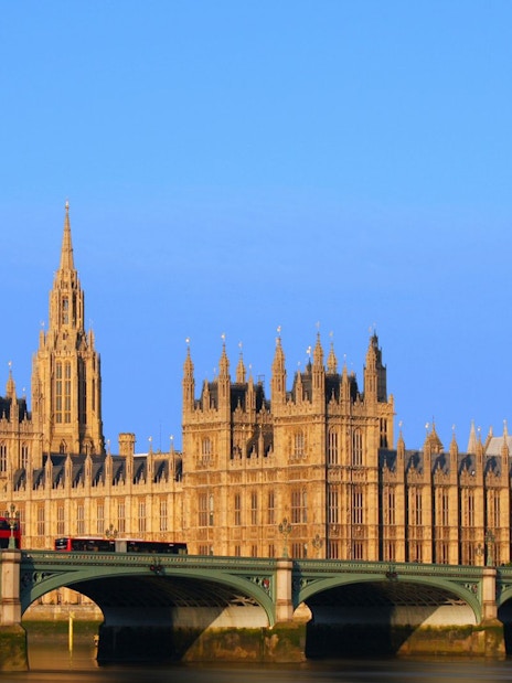 Big Ben and Palace of Westminster with tourists in foreground, London.
