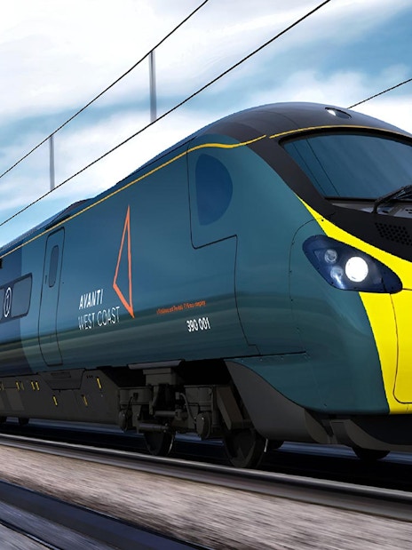Lake District cruise boat on serene water with scenic hills, part of day tour from London including cream tea.