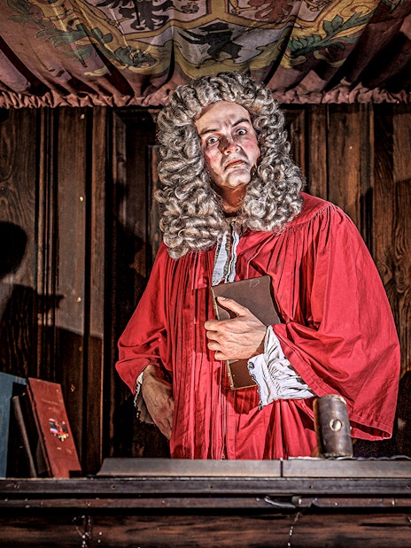 Actors reenacting a historical trial scene in The Courtroom at London Dungeon.