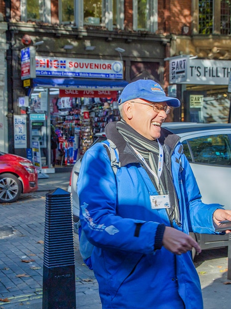 Buckingham Palace guards in traditional red uniforms during Changing of the Guard, London.