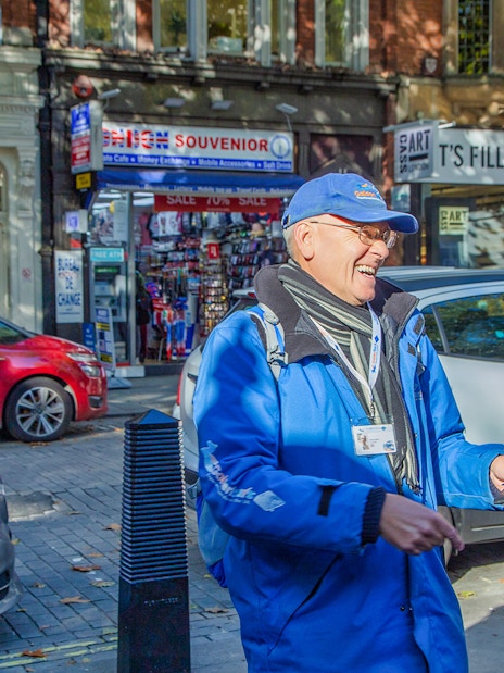 Buckingham Palace guards in traditional red uniforms during Changing of the Guard, London.