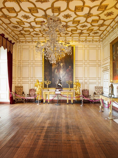 Warwick Castle with lush gardens, part of Stratford, Oxford, Cotswolds & Warwick Castle Tour.