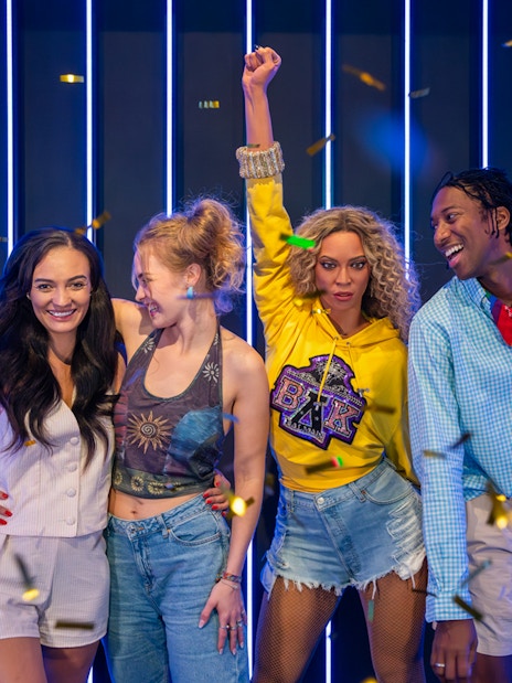 Beyonce wax figure at Madame Tussauds London in a glamorous pose.