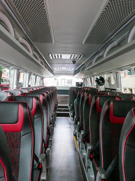 Stonehenge stone circle with tourists on a day trip from London.