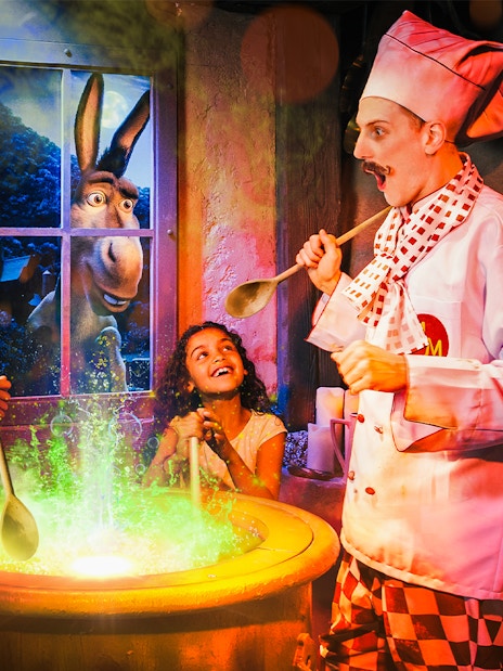 Visitors enjoying interactive Shrek's Adventure! London Tickets tour, featuring beloved Shrek characters and immersive storytelling